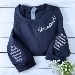 Folded Black Grandma Sweatshirt with Grandkids' Names on the Sleeves