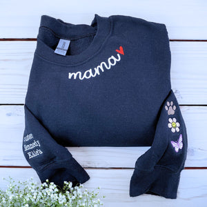Folded-Black-Mama-Sweatshirt-With-Heart-on-Neckline-and-Kids' Names-Icons-on-Sleeves