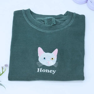 Custom white t-shirt with a embroidered cat dog face portrait, personalized from a customer photo