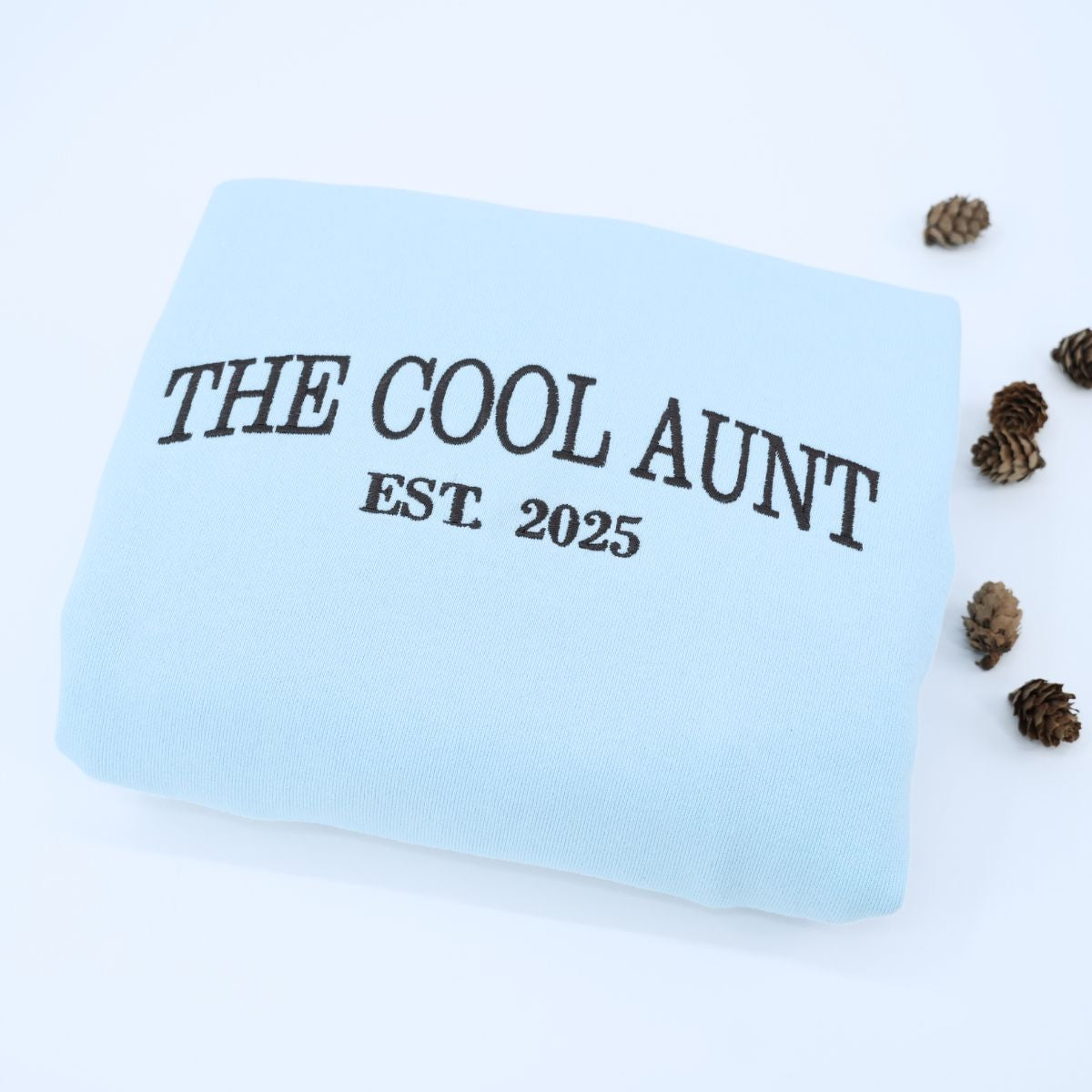 Chambray The Cool Aunt Sweatshirt with EST. 2025' embroidery, a meaningful and cozy gift for Aunt