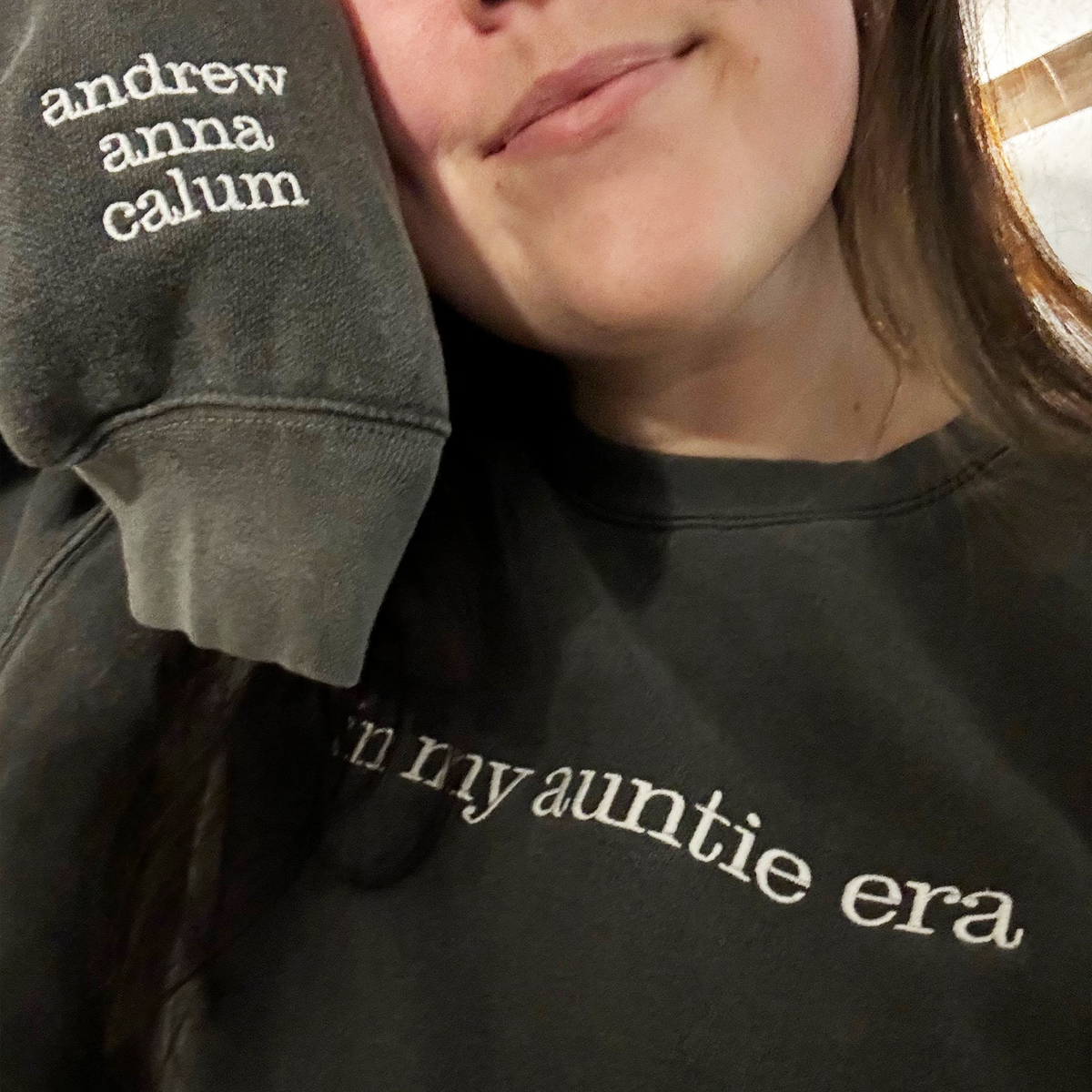 A proud Auntie showing the Auntie Sweatshirt 