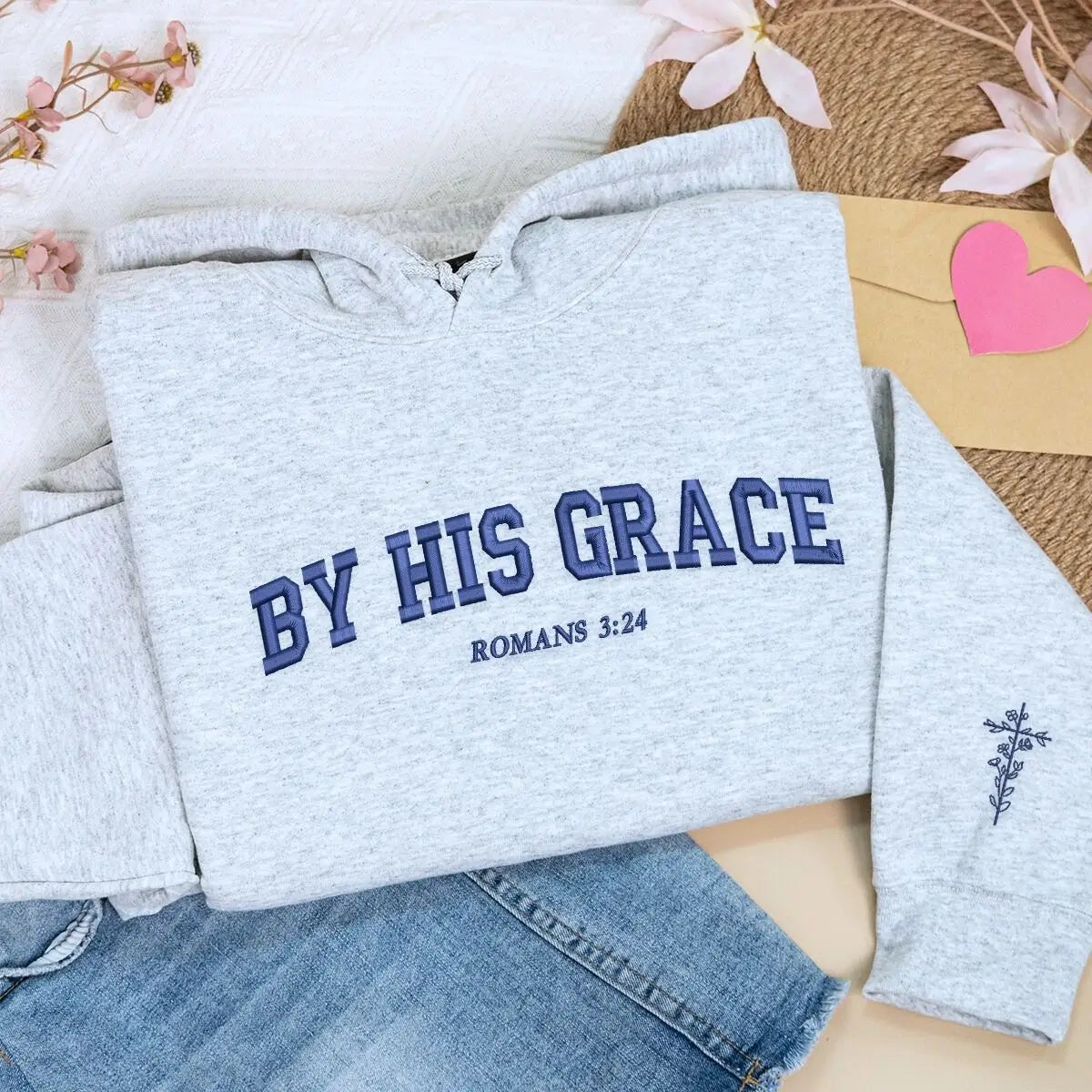 Custom embroidered Christian hoodie with floral cross on sleeve – faith-based fashion