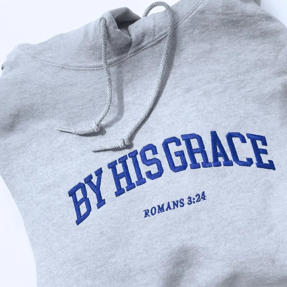 Custom embroidered Christian hoodie with floral cross on sleeve – faith-based fashion