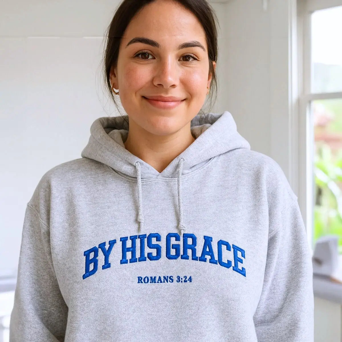 Custom embroidered Christian hoodie with floral cross on sleeve – faith-based fashion