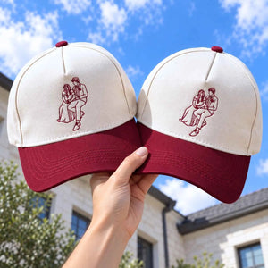 Matching embroidered couple portrait hats with maroon visor for anniversary gift