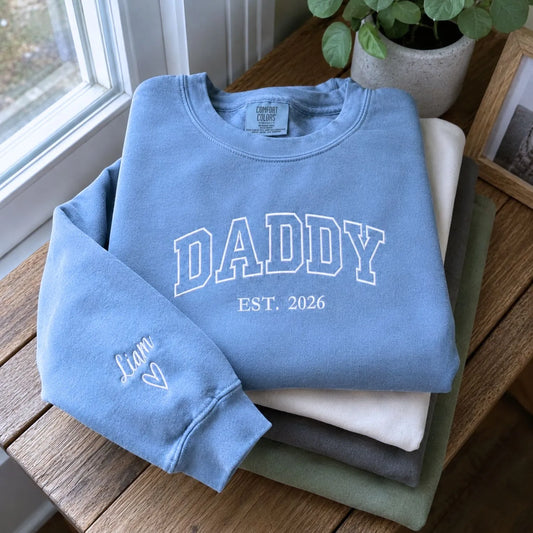 Custom embroidered Daddy Est t-shirt with high-density stitching, personalized gift for a new dad.