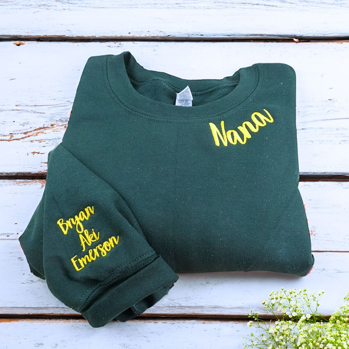 Folded Forest Green Nana Sweatshirt with Grandkids' Names on Sleeve, A Meaningful and cozy Gift for Nana