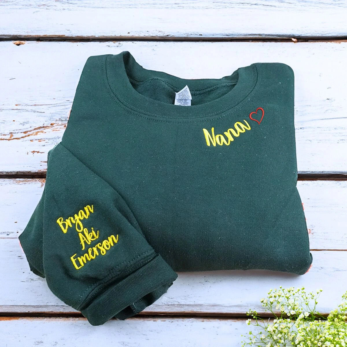 Folded Forest Green Nana Sweatshirt with Grandkids' Names on Sleeve, A Meaningful and cozy Gift for Nana