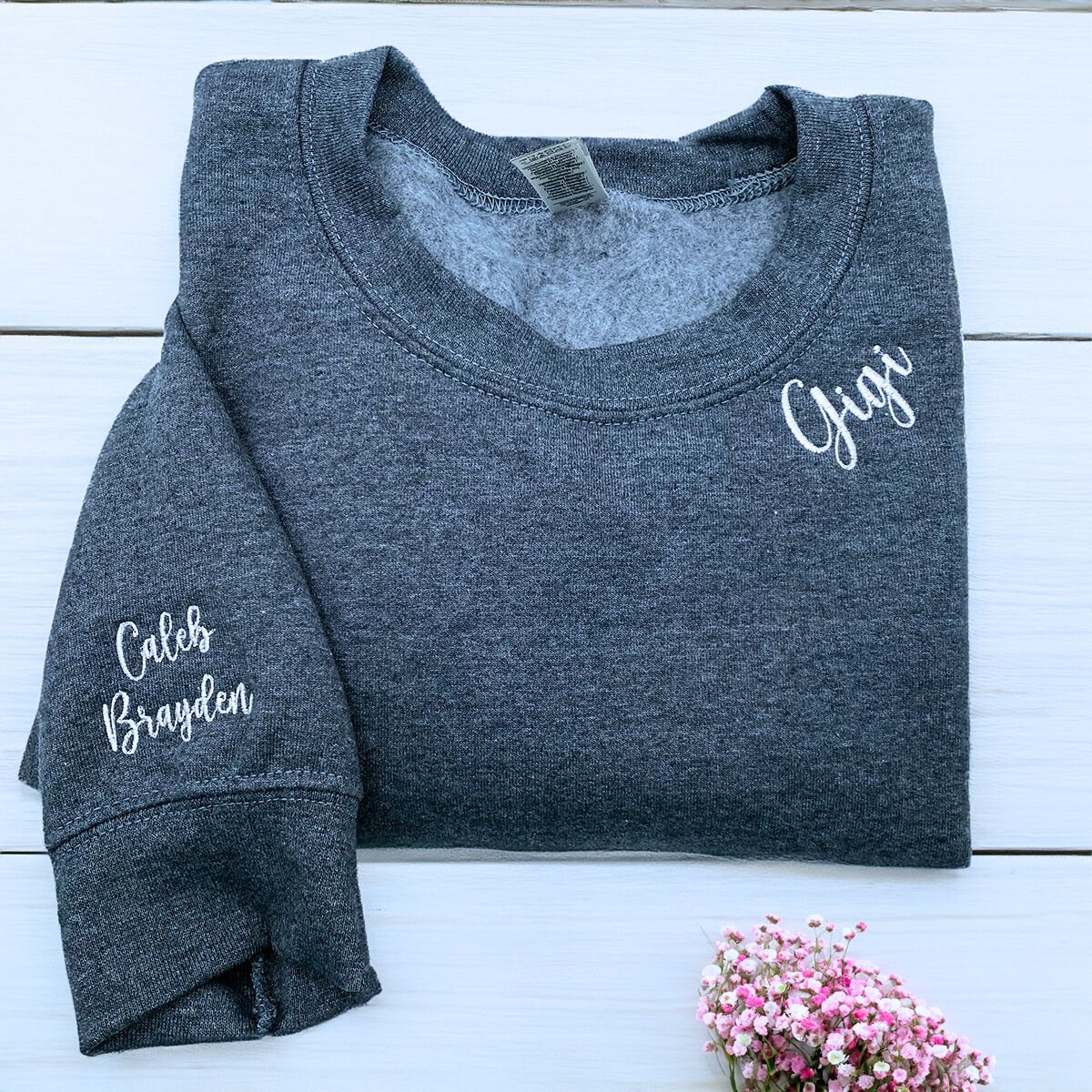 Charcoal Gigi Sweatshirt with Grandkids' Names and heart icon on sleeve, a meaningful and cozy for Gigi