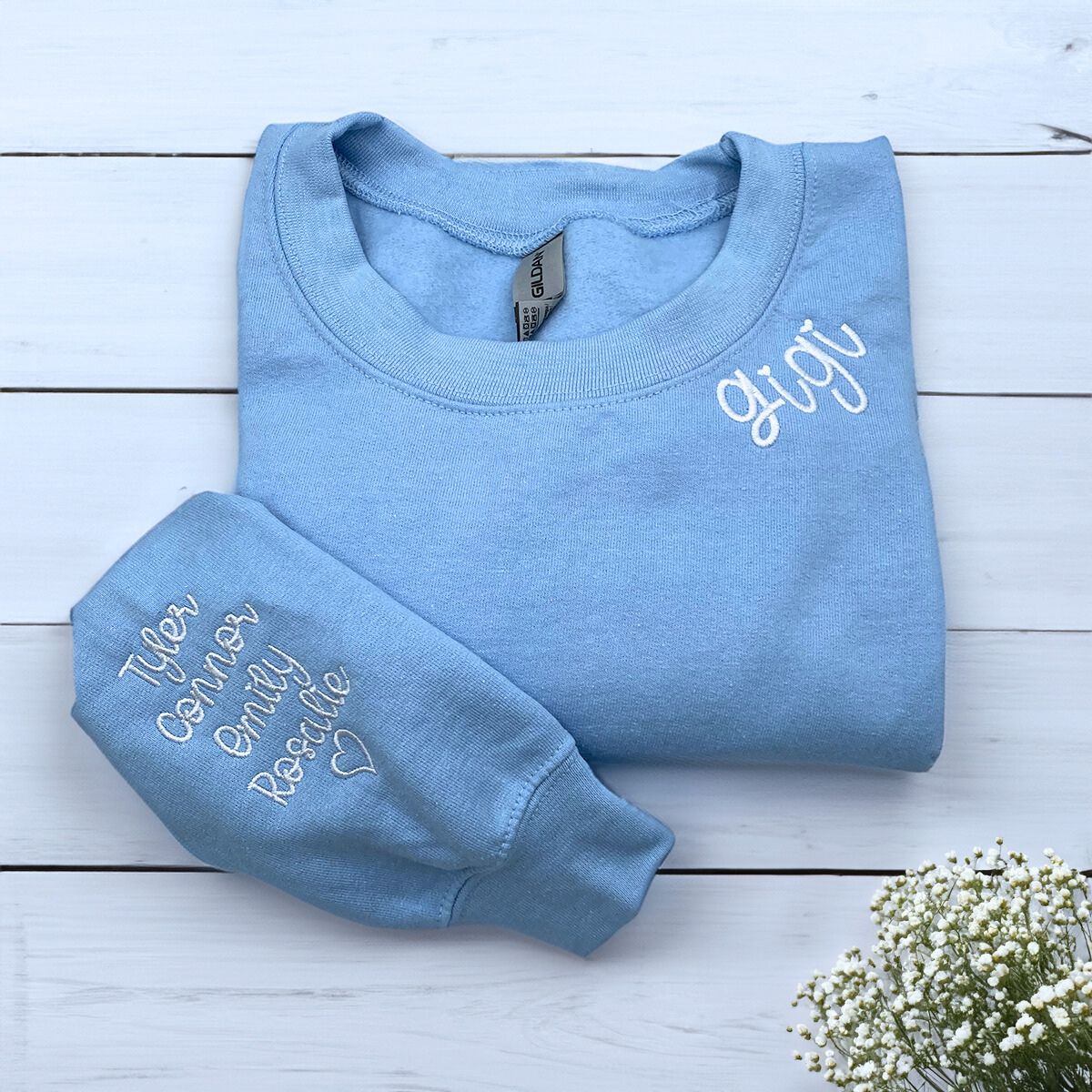 Light Blue Gigi Sweatshirt with Grandkids' Names and heart icon on sleeve, a meaningful and cozy for Gigi
