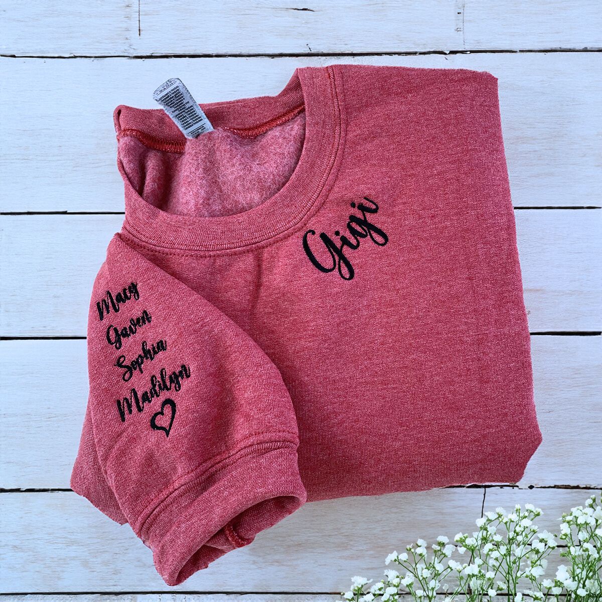 Red Gigi Sweatshirt with Grandkids' Names and heart icon on sleeve, a meaningful and cozy for Gigi
