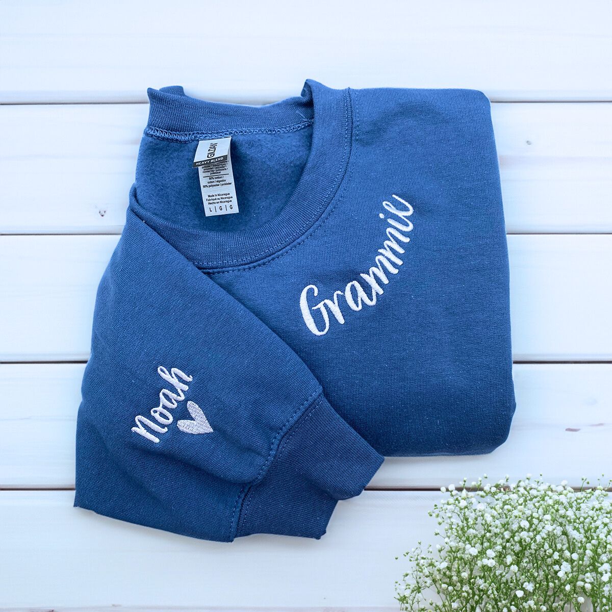 Indigo Blue Grammie Sweatshirt with Grandkids' names and heart icon on sleeve, a meaningful and cozy gift for Grammie