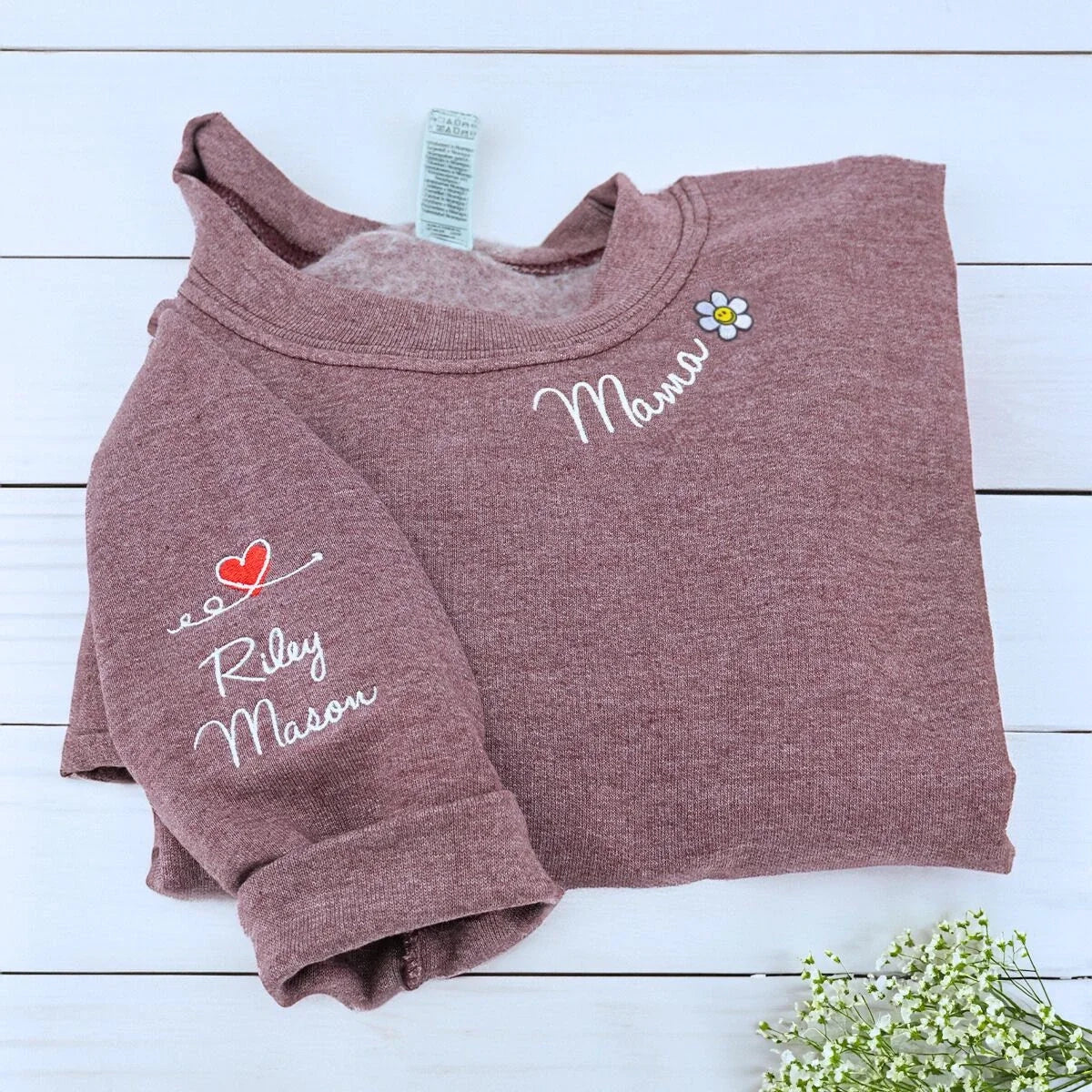 Heather Dark Maroon Mama Sweatshirt with flower icon and kids names on sleeve, a meaningful and cozy gift for mama