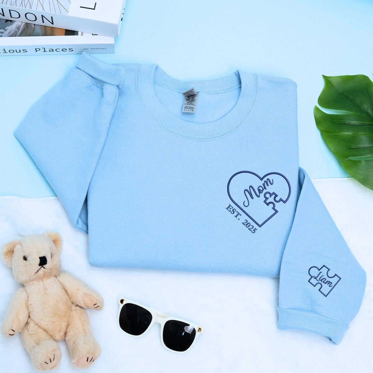 Mom Light Blue Sweatshirt with 'Est. 2025' embroidery and kid names on sleeve, a meaningful and cozy gift for Mom