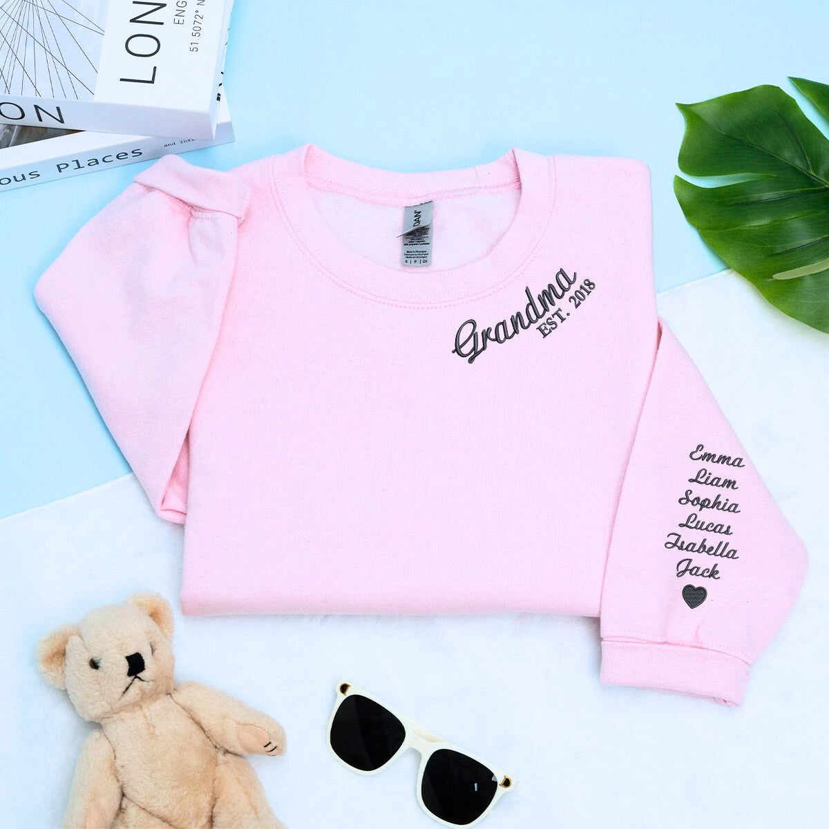 Light Pink Grandma Sweatshirt with 'Est. 2018' embroidery with grandkids names on sleeve, a meaningful and cozy gift for Grandma