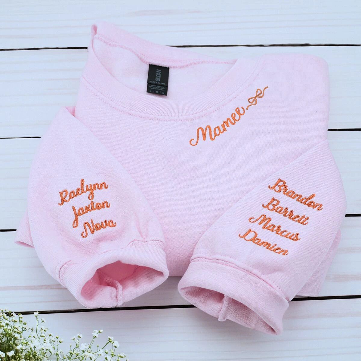 Light Pink Mamee Sweatshirt with bow icon and kids names on sleeve, a meaningful and cozy gift for mama