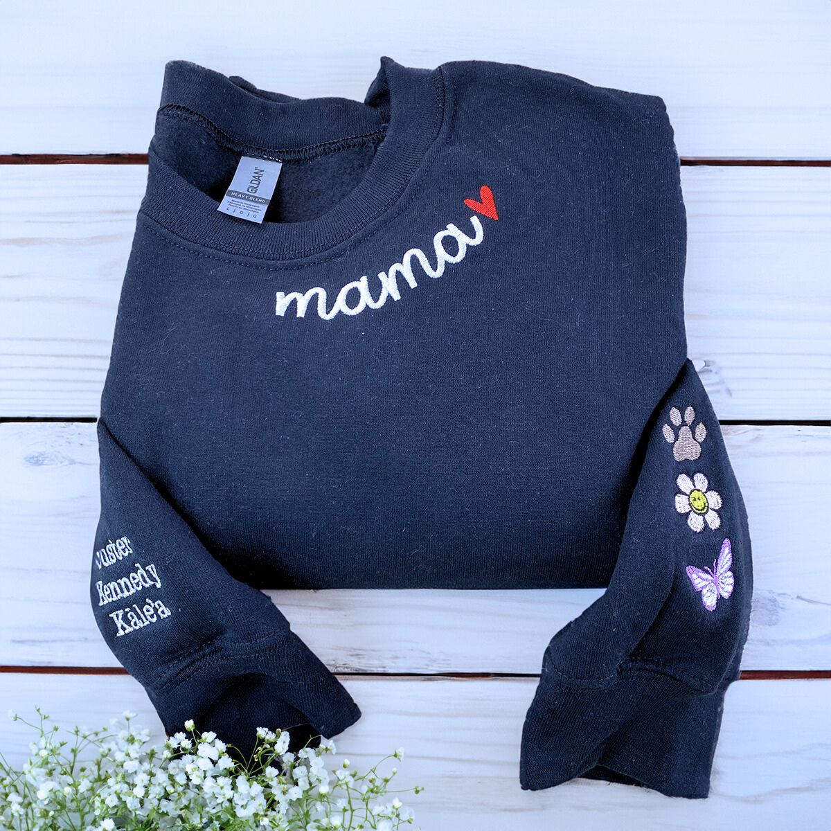 Folded-Black-Mama-Sweatshirt-With-Heart-on-Neckline-and-Kids' Names-Icons-on-Sleeves