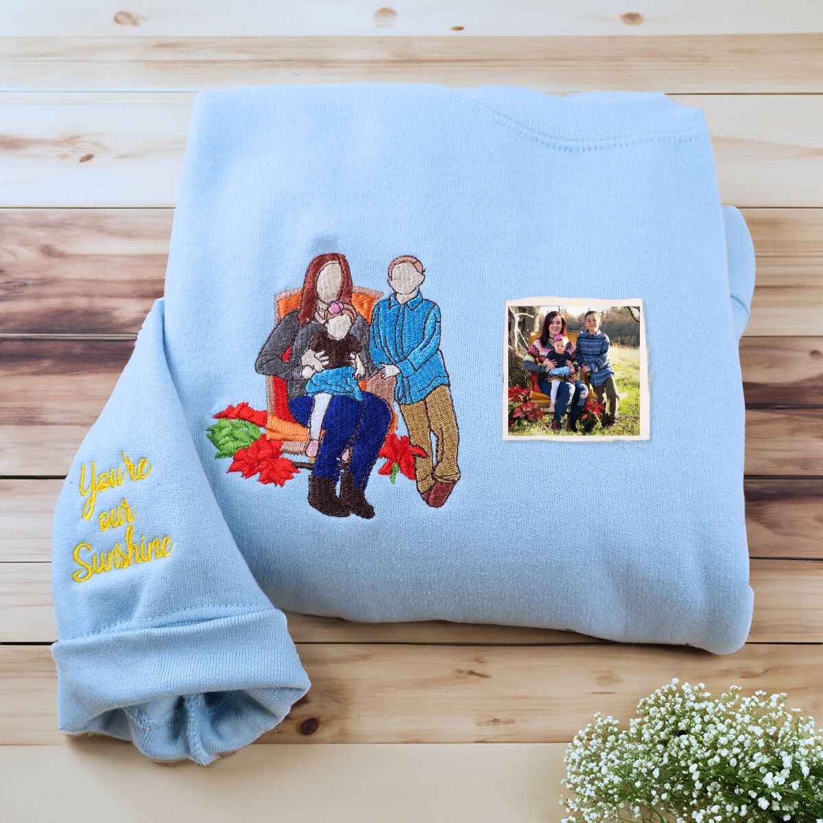 Folded Light Blue Sweatshirt with Custom Quote on Sleeve, a meaningful and cozy gift for Mom