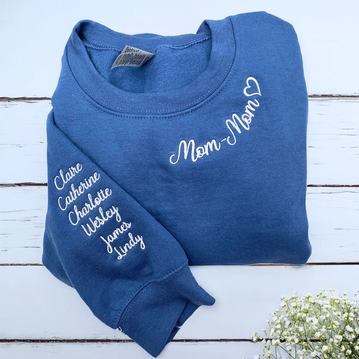 Folded Indigo Blue Mom-mom Sweatshirt with Kids' Names on the Sleeve