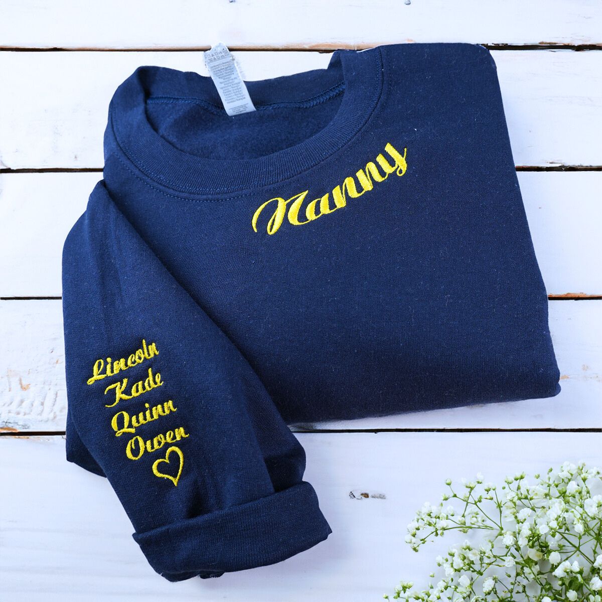 Folded Navy Nanny Sweatshirt with Grandkids' Names on Sleeve, A Meaningful and cozy Gift for Nanny