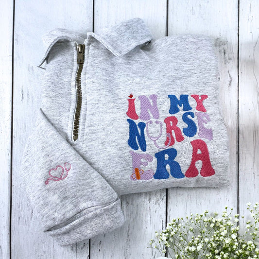 In My Nurse Era Quarter Zip Sweatshirt or Hoodie, Personalized Embroidered Gift For Nurse - Embroly