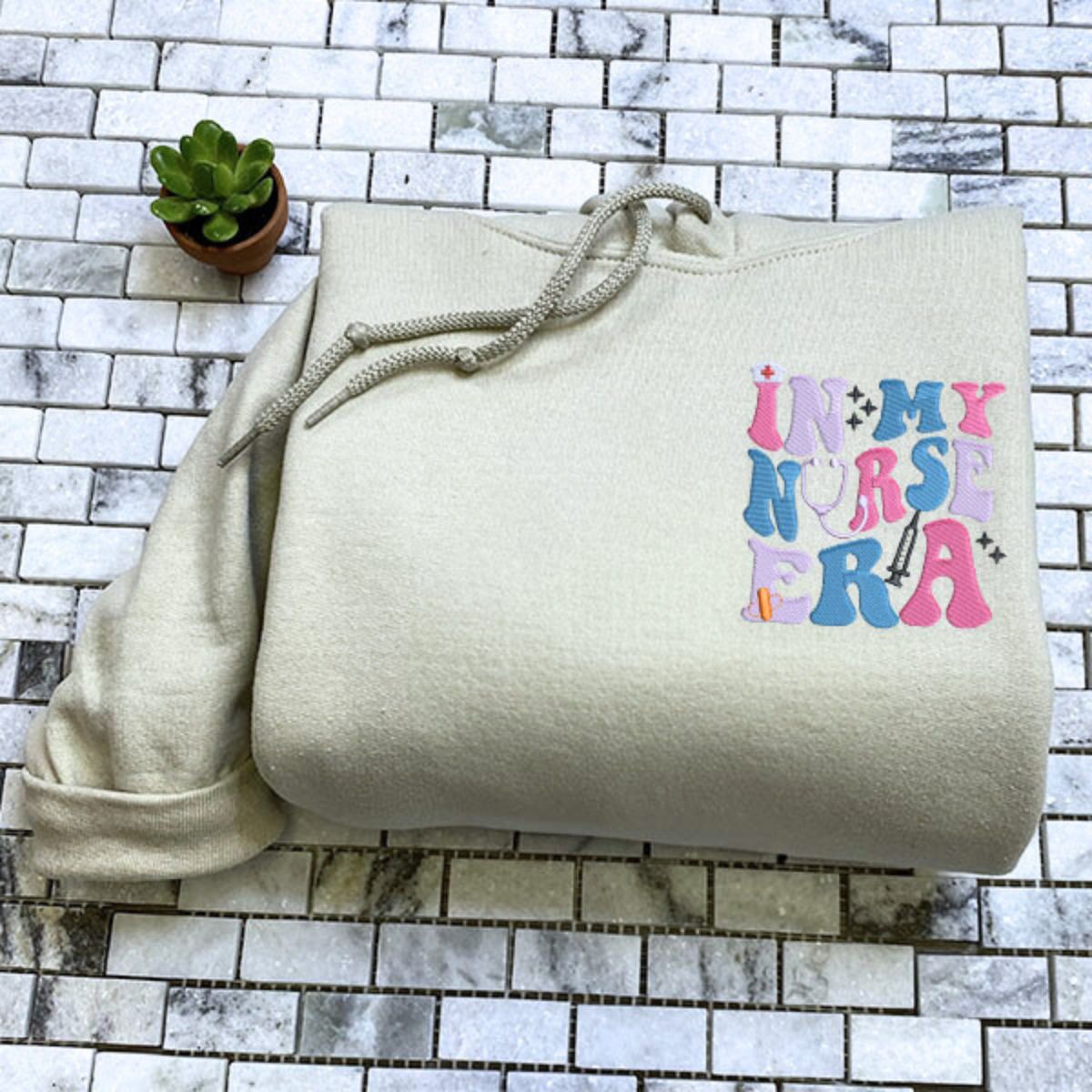 In My Nurse Era Quarter Zip Sweatshirt or Hoodie, Personalized Embroidered Gift For Nurse - Embroly