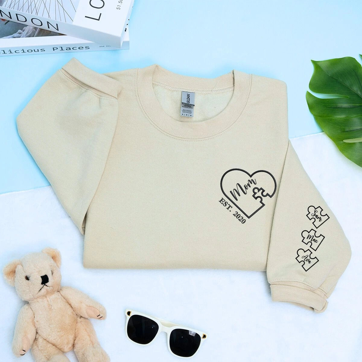 Mom Sand Sweatshirt with 'Est. 2020' embroidery and kid names on sleeve, a meaningful and cozy gift for Mom