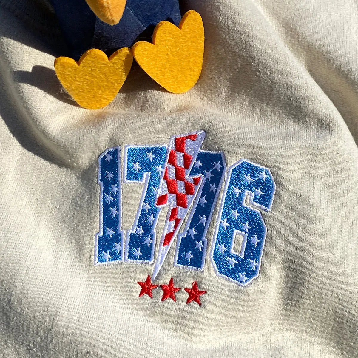 Embroidered 1776 Thunderstorm Sweatshirt on Fourth of July