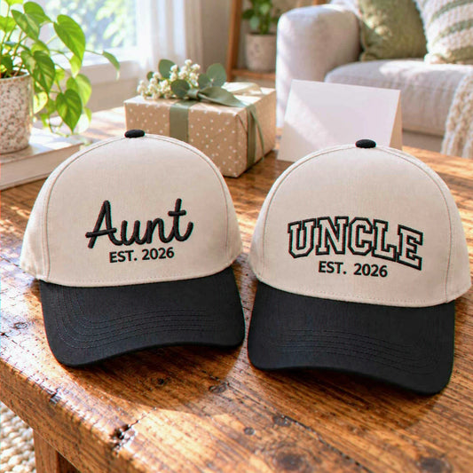 Matching khaki Aunt and Uncle embroidered baseball caps with black brims and EST year details, a birthday gift for an aunt and uncle