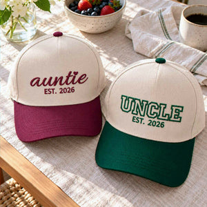Khaki Green Khaki Maroon Auntie and Uncle embroidered baseball caps with burgundy and forest green brims, a pregnancy announcement gift for a new aunt and uncle.