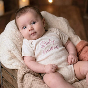 Embroidered baby announcement onesie with “Baby Loading” text for pregnancy reveal