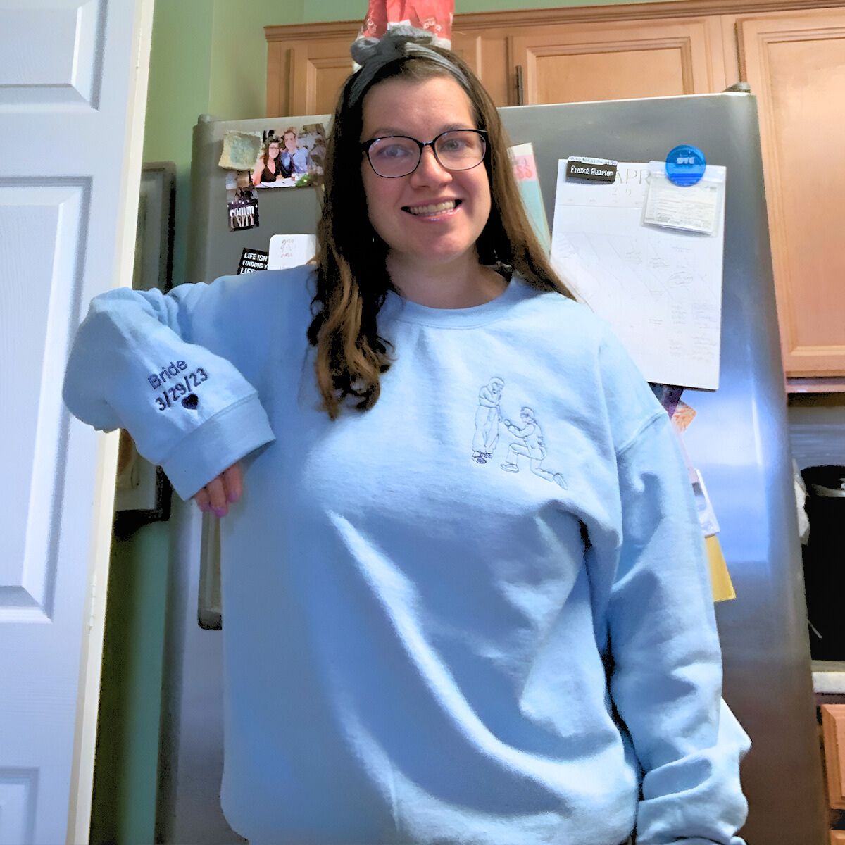 Light blue sweatshirt with a proposal embroidery, a meaningful gift for the bride-to-be.