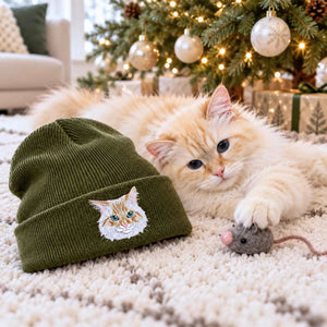 An olive green knit beanie with an embroidered cat face, gift for cat mom on christmas day