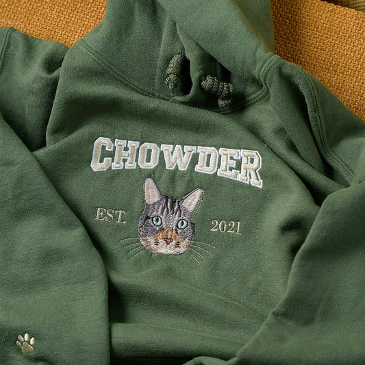 cat photo into a custom embroidered military green hoodie with their name and year, made for cat moms, pet lovers, and everyday memories