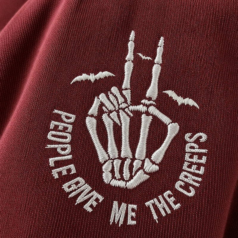 Embroidered Comfort Color® Halloween Sweatshirt - People Give Me The Creeps Skeleton Hand Pullover
