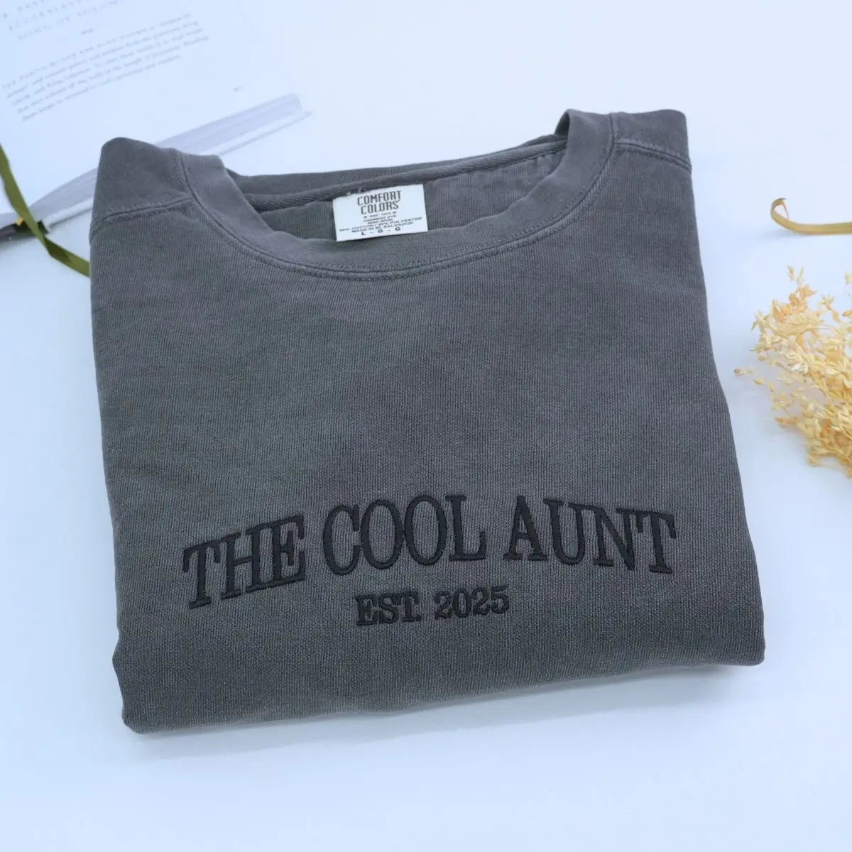 Custom embroidered sweatshirt with “Cool Aunt” text and Est. Year, cozy personalized gift for new or proud aunt.