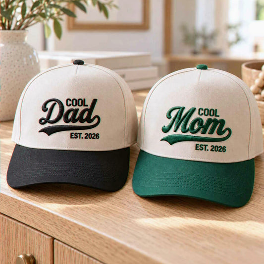 Matching Cool Dad and Cool Mom Est 2026 embroidered baseball caps in black and green