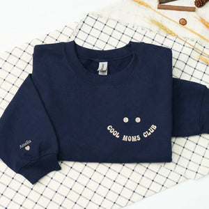 Personalized Cool Moms Club sweatshirt with kids names embroidered on a cozy custom mom gift sweatshirt