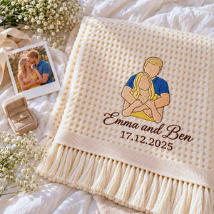 Cream waffle blanket embroidered with a custom color couple portrait, Emma and Ben names, and personalized date.