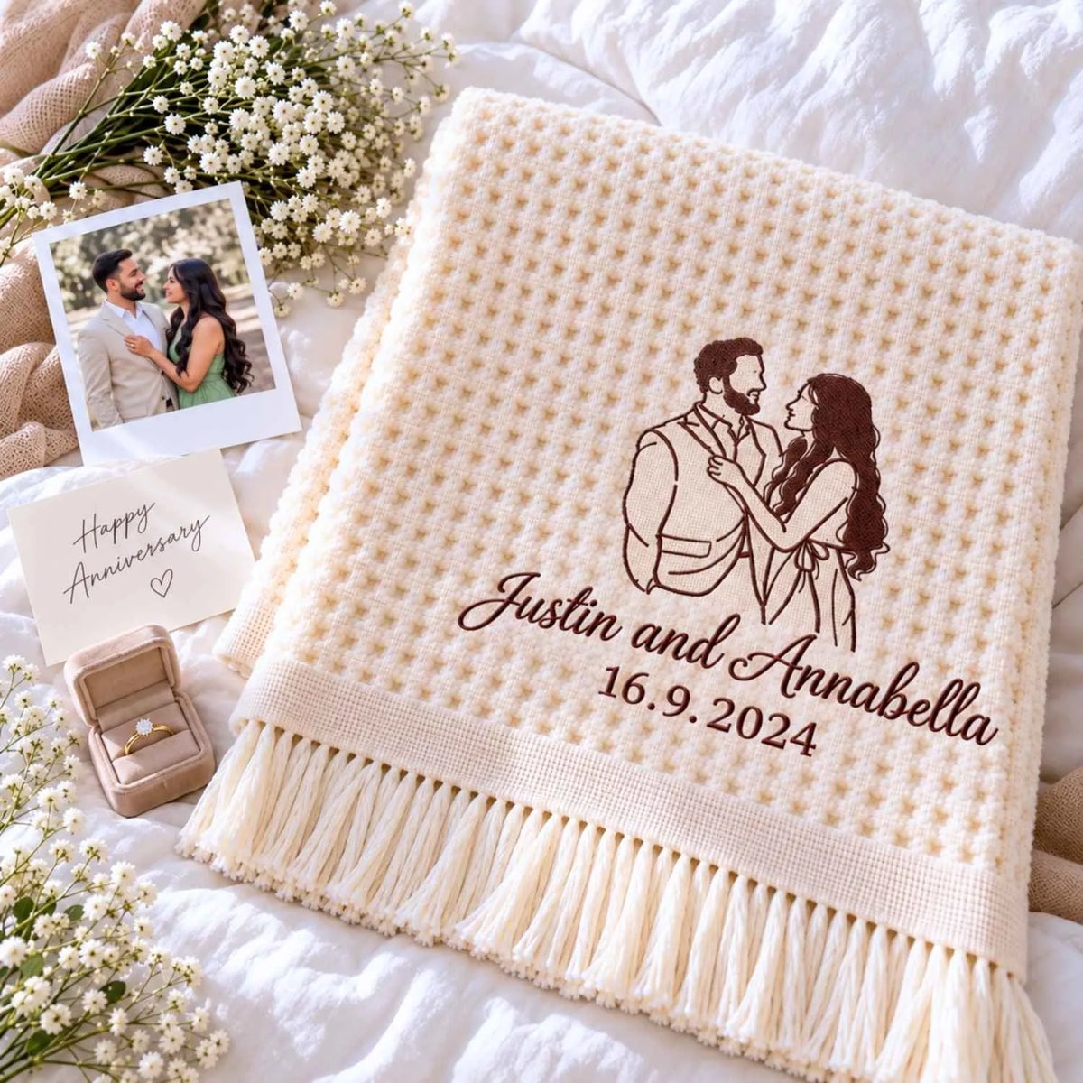Cream waffle blanket embroidered with a custom couple line art portrait, names and anniversary date.