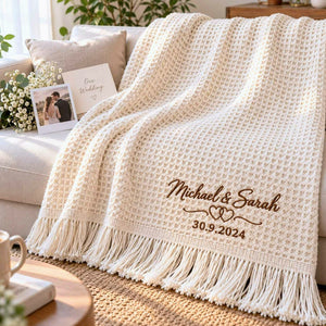 Cream waffle blanket with brown embroidered couple names, intertwined hearts and personalized wedding date.