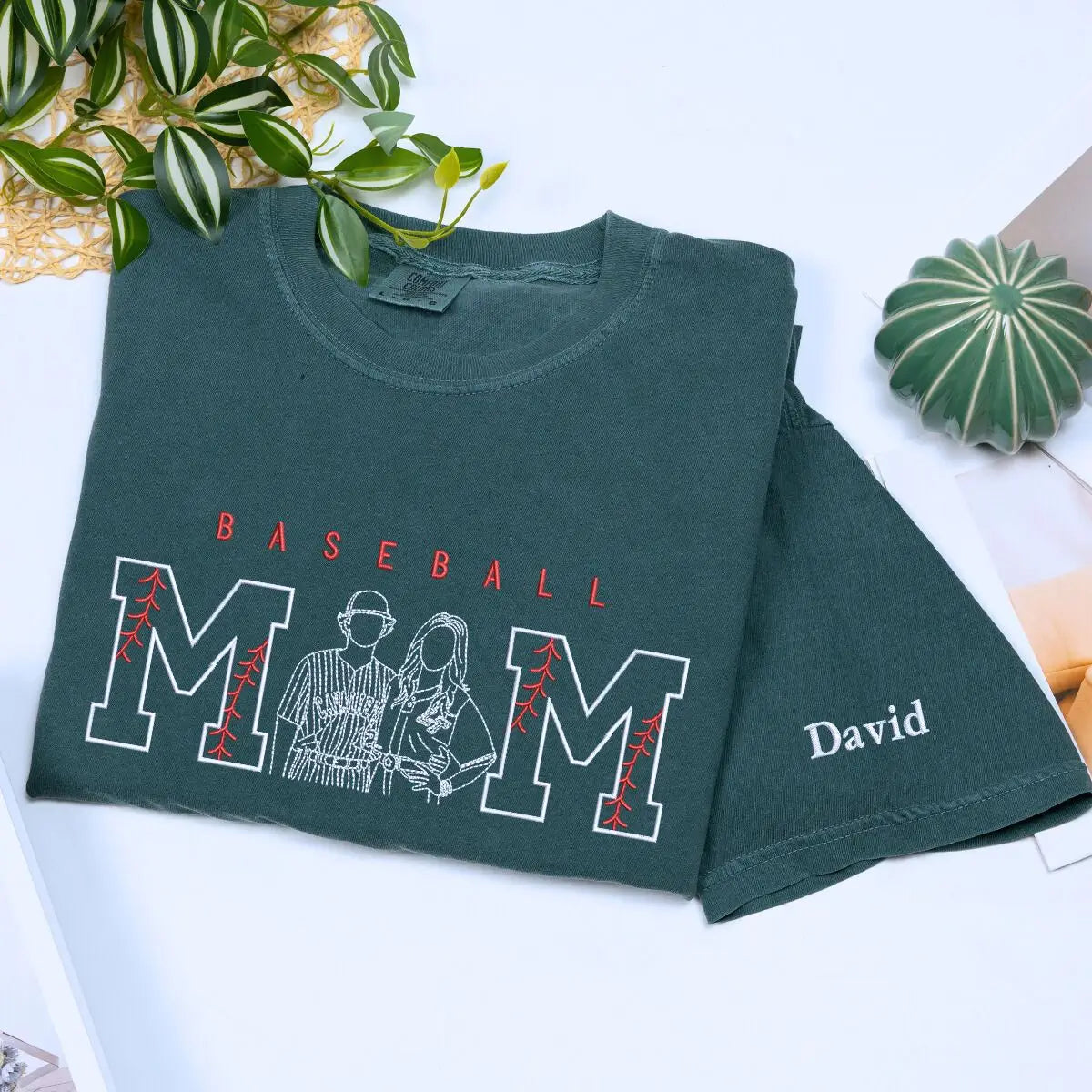Custom embroidered baseball mom shirt with child’s portrait and personalized sleeve text