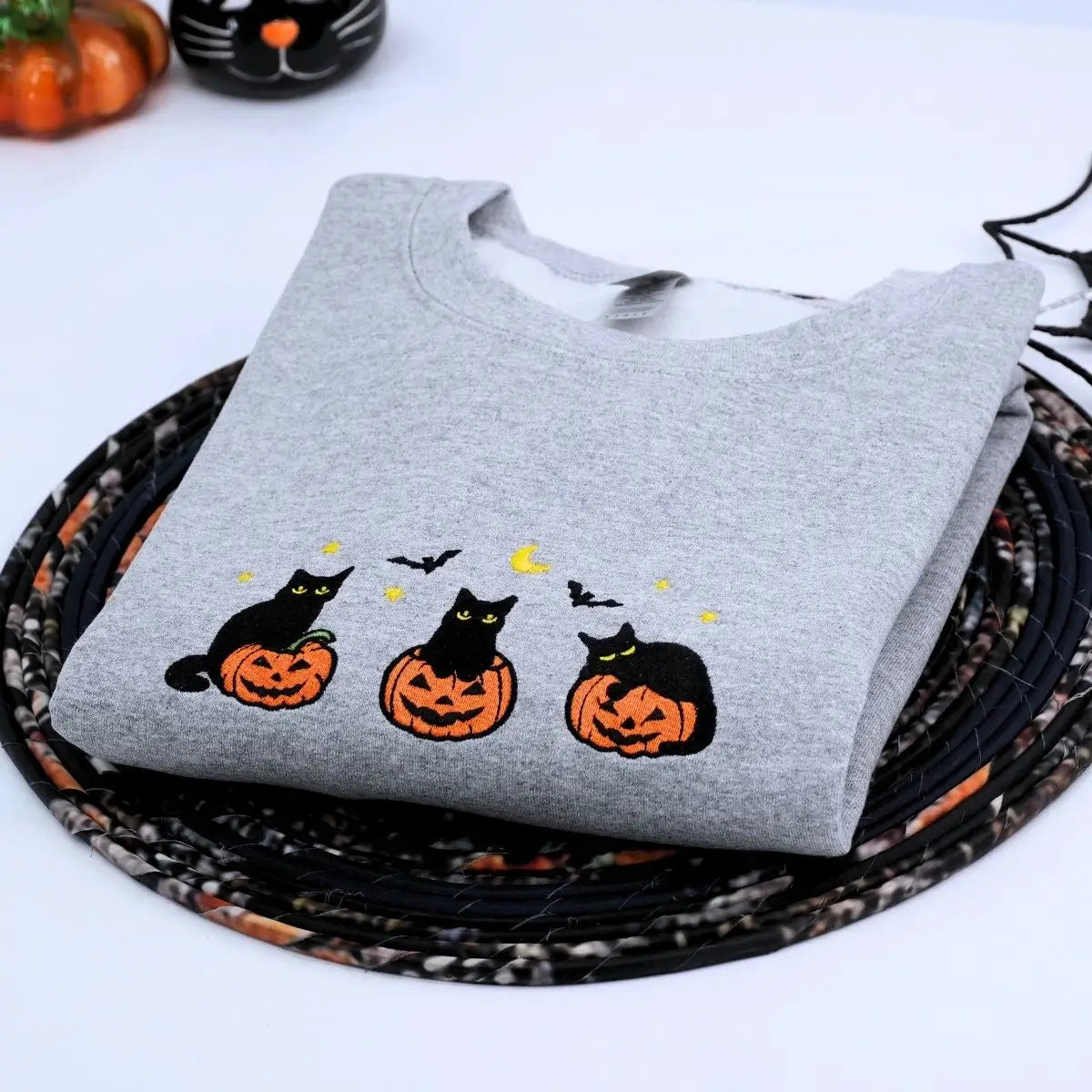 Custom embroidered black cat Halloween sweatshirt with pumpkin, bats, moon and personalized sleeve text