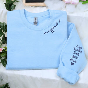 Custom embroidered mama sweatshirt with coquette bow and kids names stitched on sleeve in soft neutral fabric