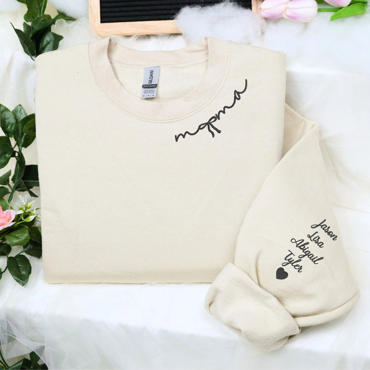 Custom embroidered mama sweatshirt with coquette bow and kids names stitched on sleeve in soft neutral fabric