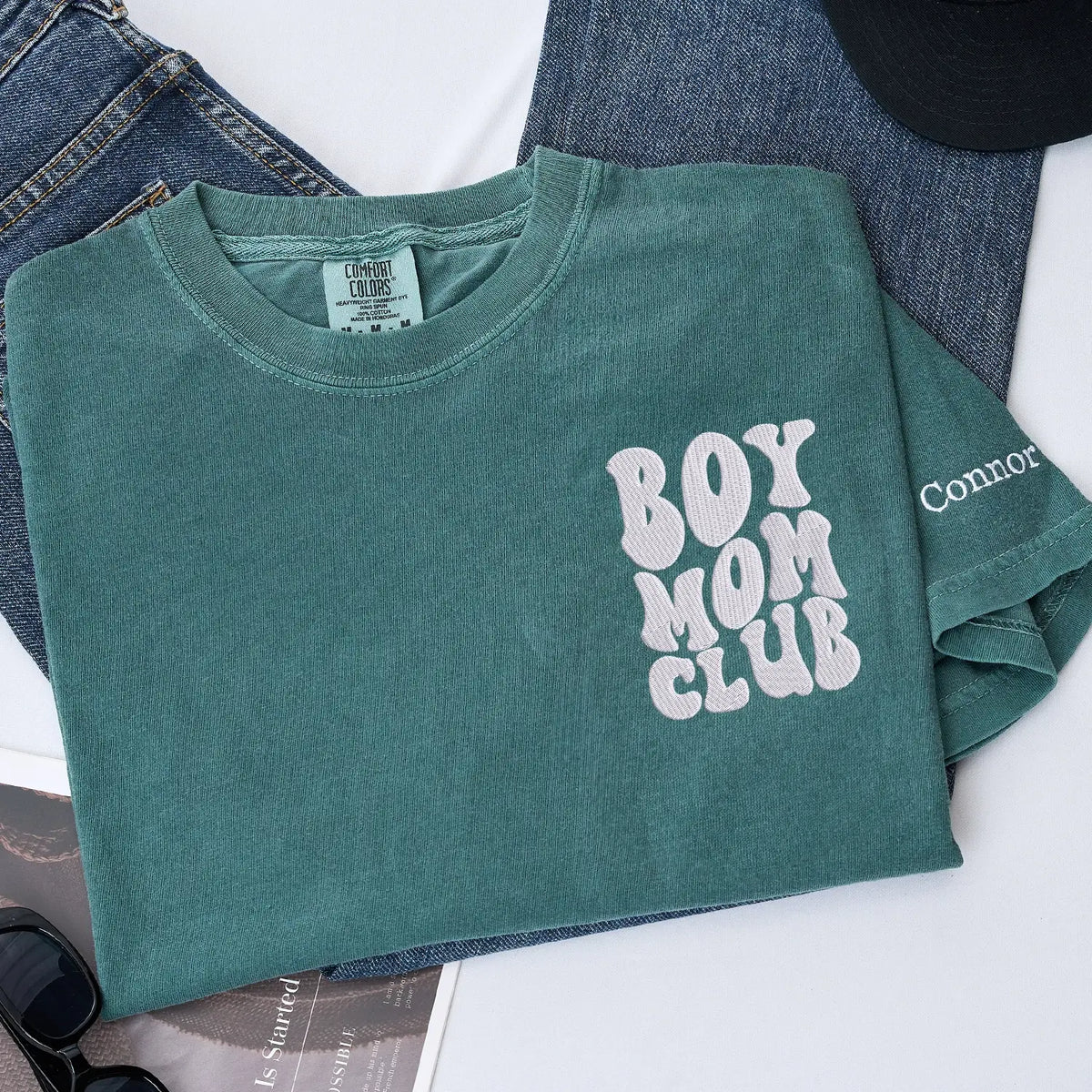 Custom embroidered boy mom shirt with kids names on sleeve personalized gift for new mother wearing casual outfit