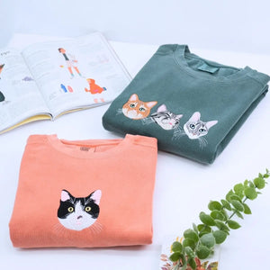 Close-up of custom embroidered dog cat portrait on a Comfort Colors® sweatshirt based on a customer photo
