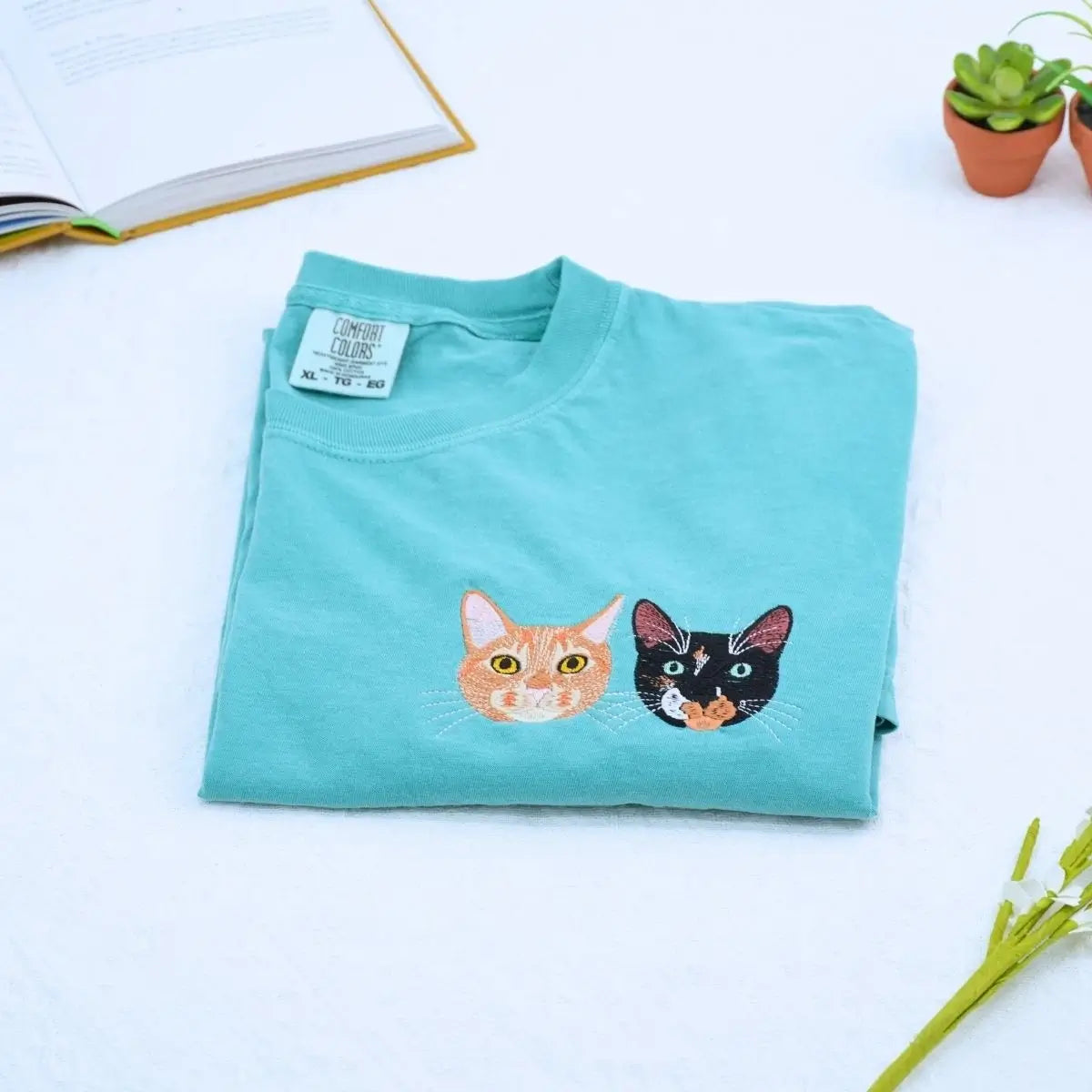 Close-up of custom embroidered dog cat portrait on a Comfort Colors® sweatshirt based on a customer photo