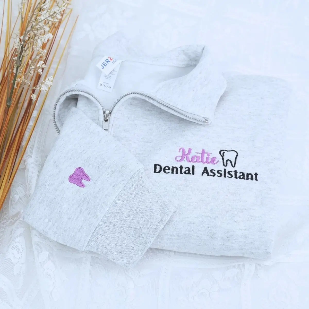 Custom embroidered quarter zip sweatshirt for dental assistant with name or icon on sleeve