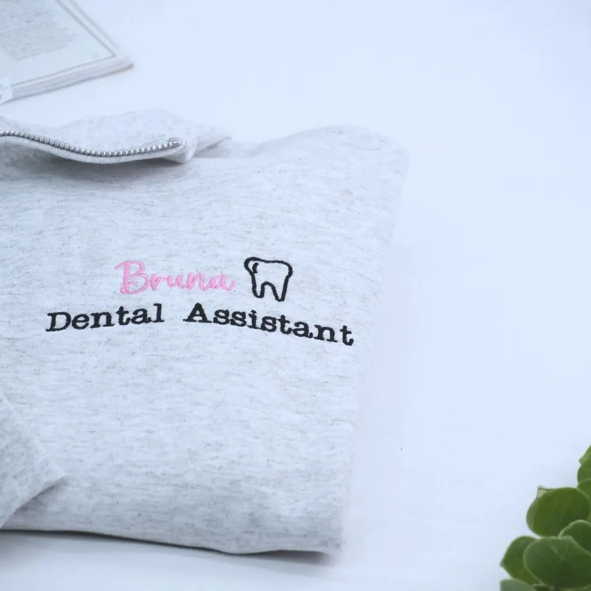 Custom embroidered quarter zip sweatshirt for dental assistant with name or icon on sleeve